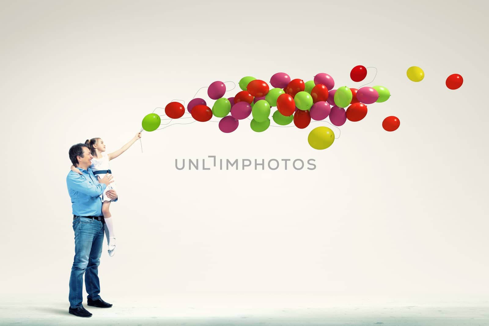 Image of happy father holding on hands daughter and balloons