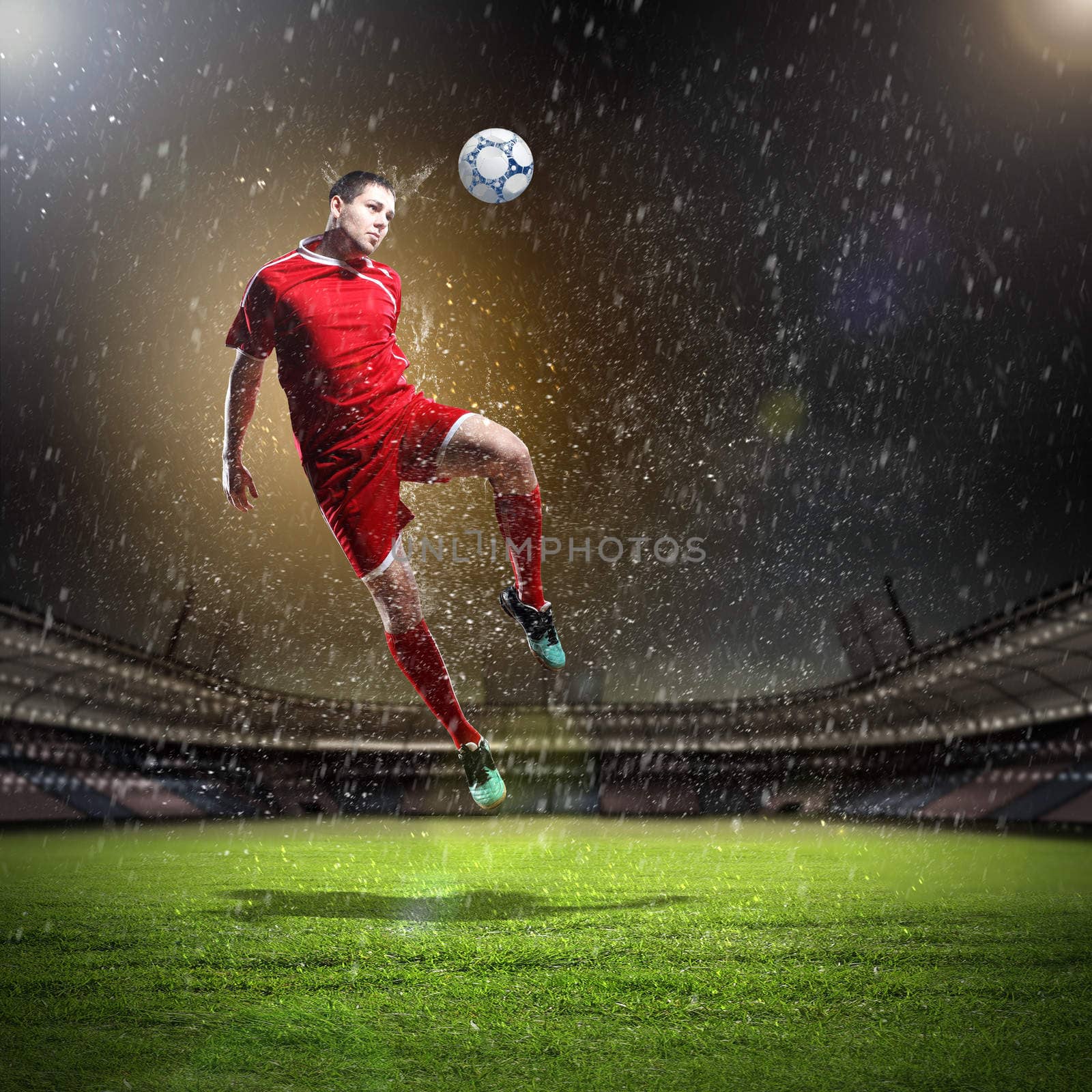 football player in red shirt striking the ball at the stadium under rain