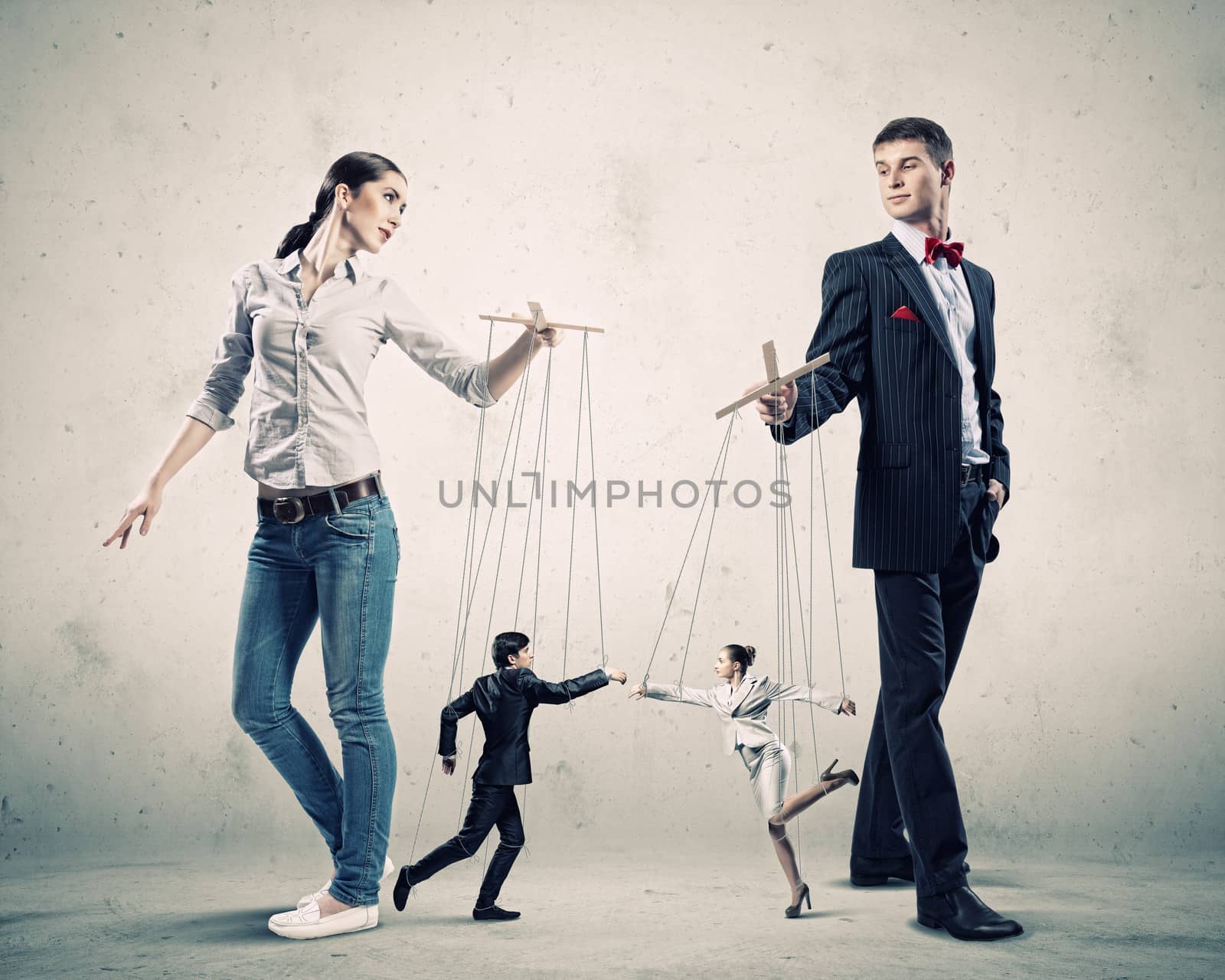 Image of man and woman with marionette puppets