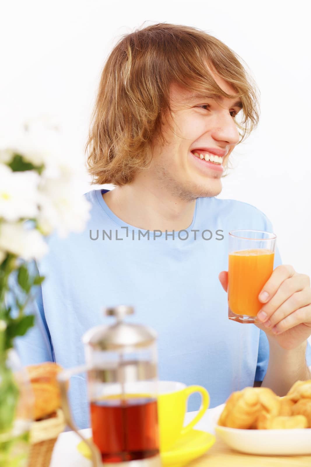 Young man drinking juice by sergey_nivens
