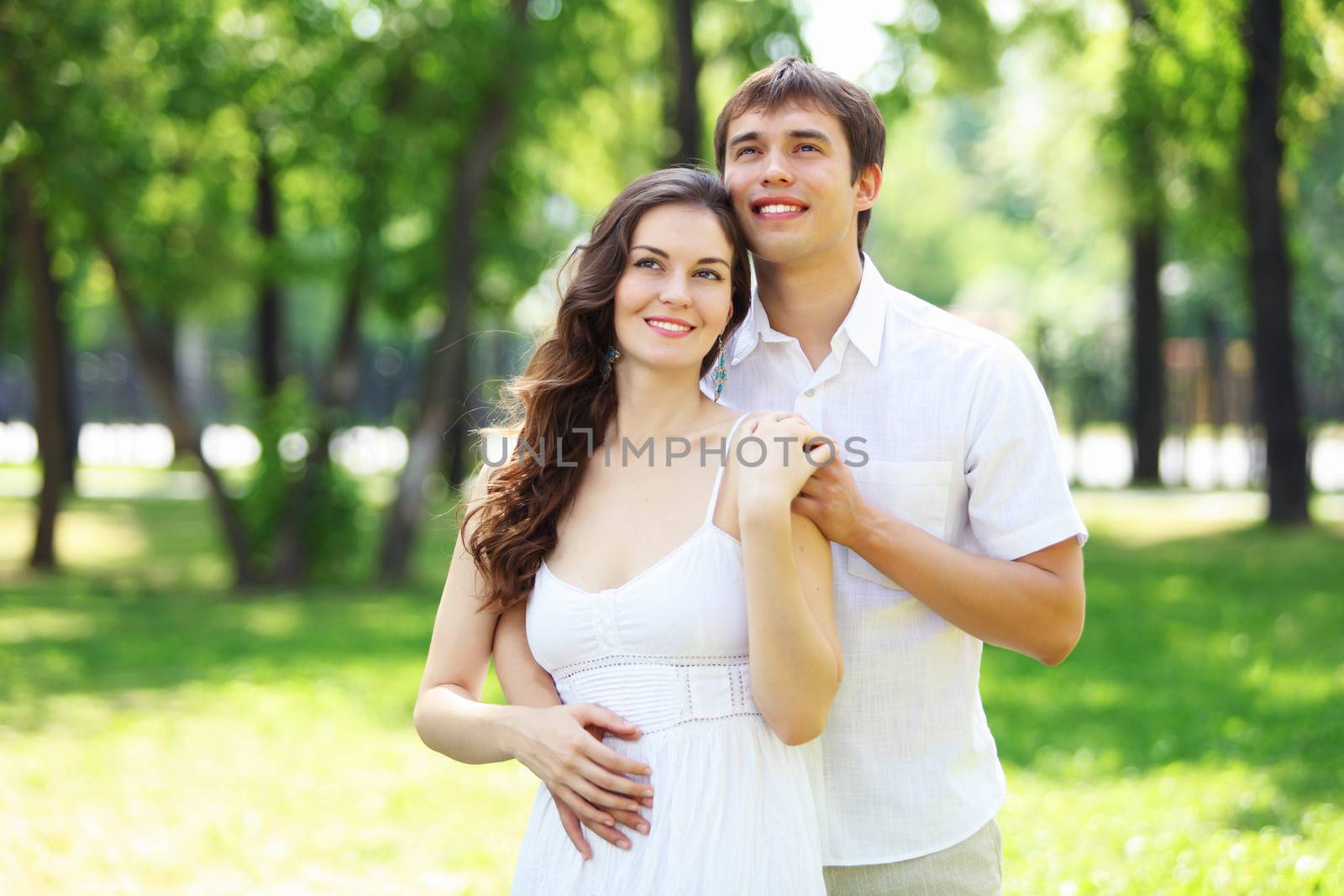 Young love Couple smiling under blue sky by sergey_nivens