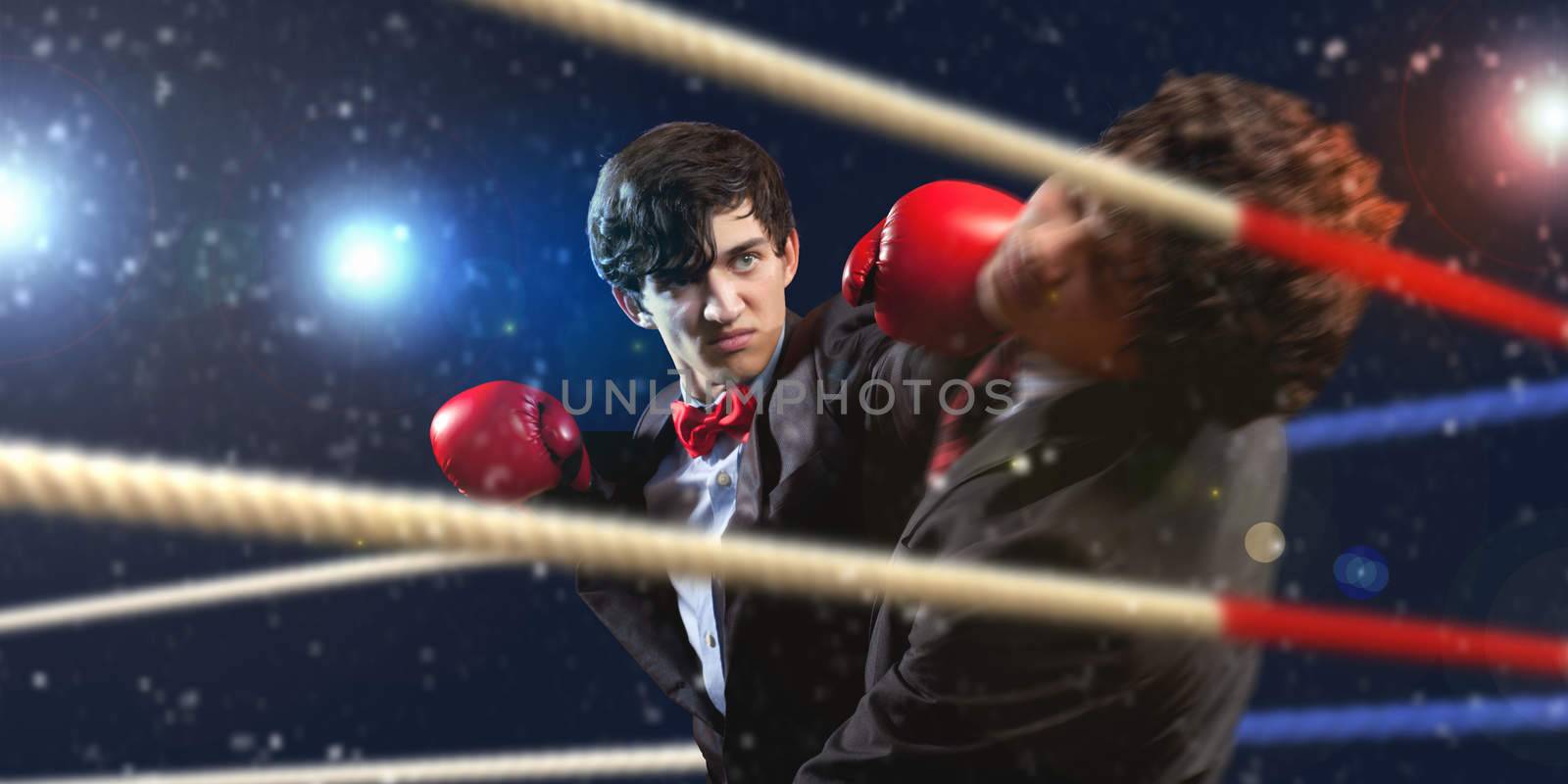 Two young businessman boxing by sergey_nivens