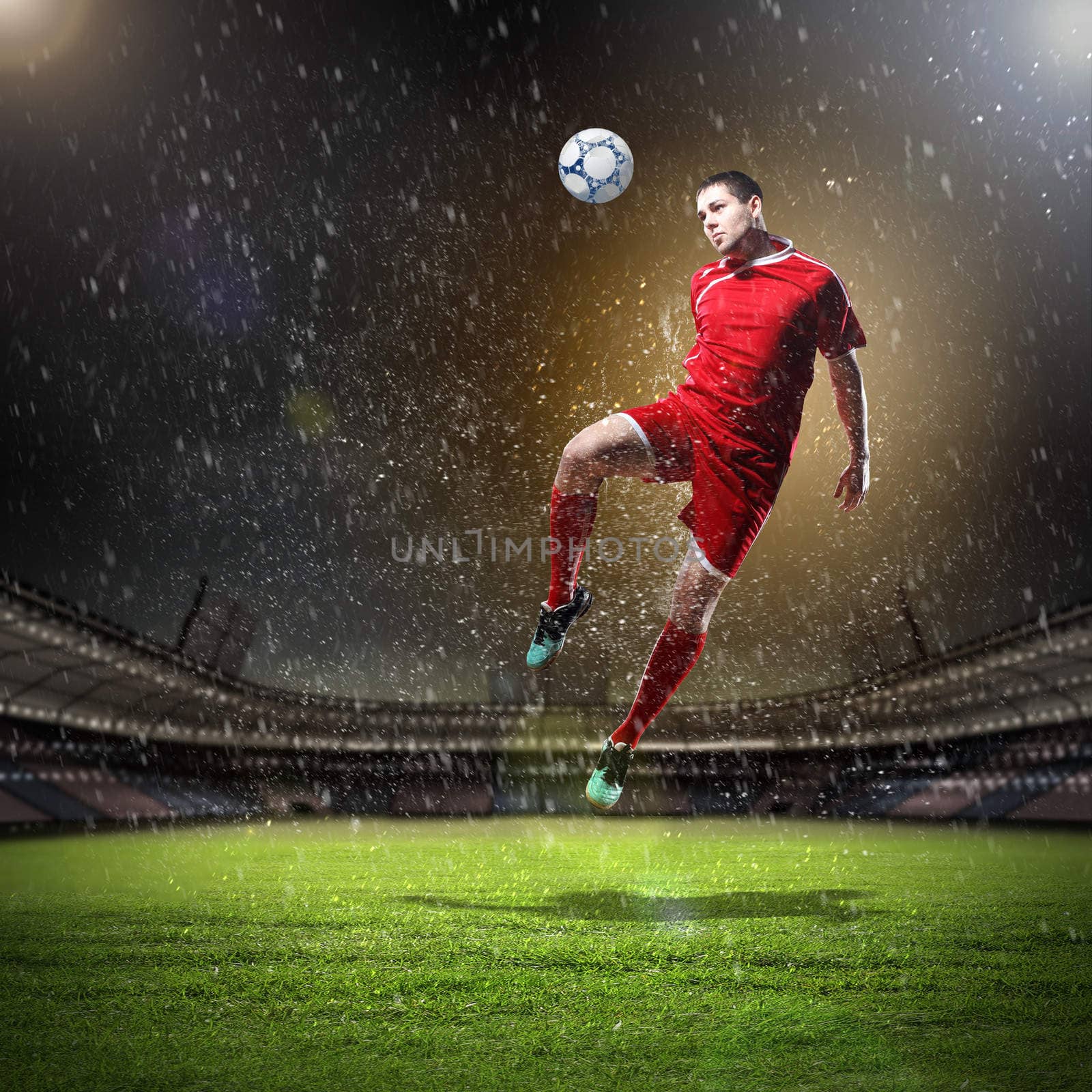 football player in red shirt striking the ball at the stadium under rain