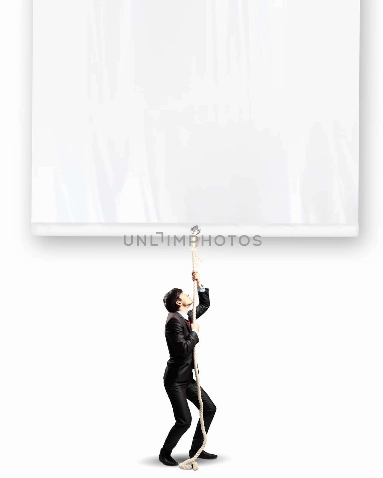 Image of businessman pulling blank banner. Place for text