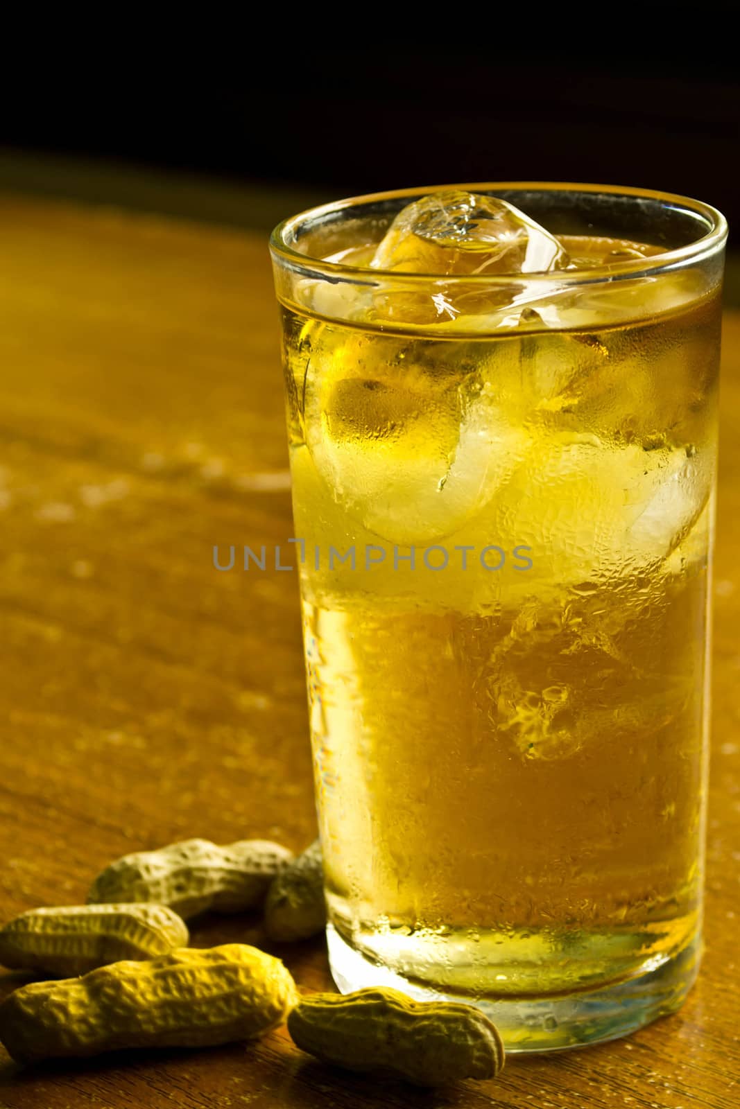 Whisky and beans on wooden table