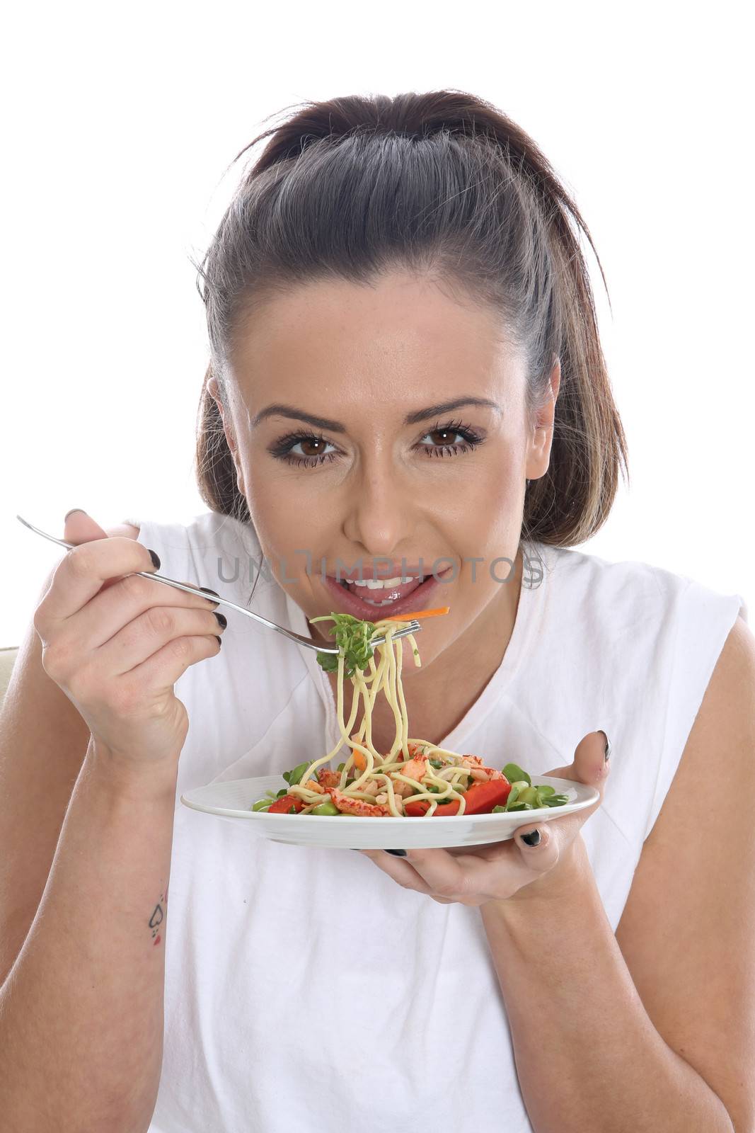 Model Released. Young Woman Eating Prawn and Noodle Salad