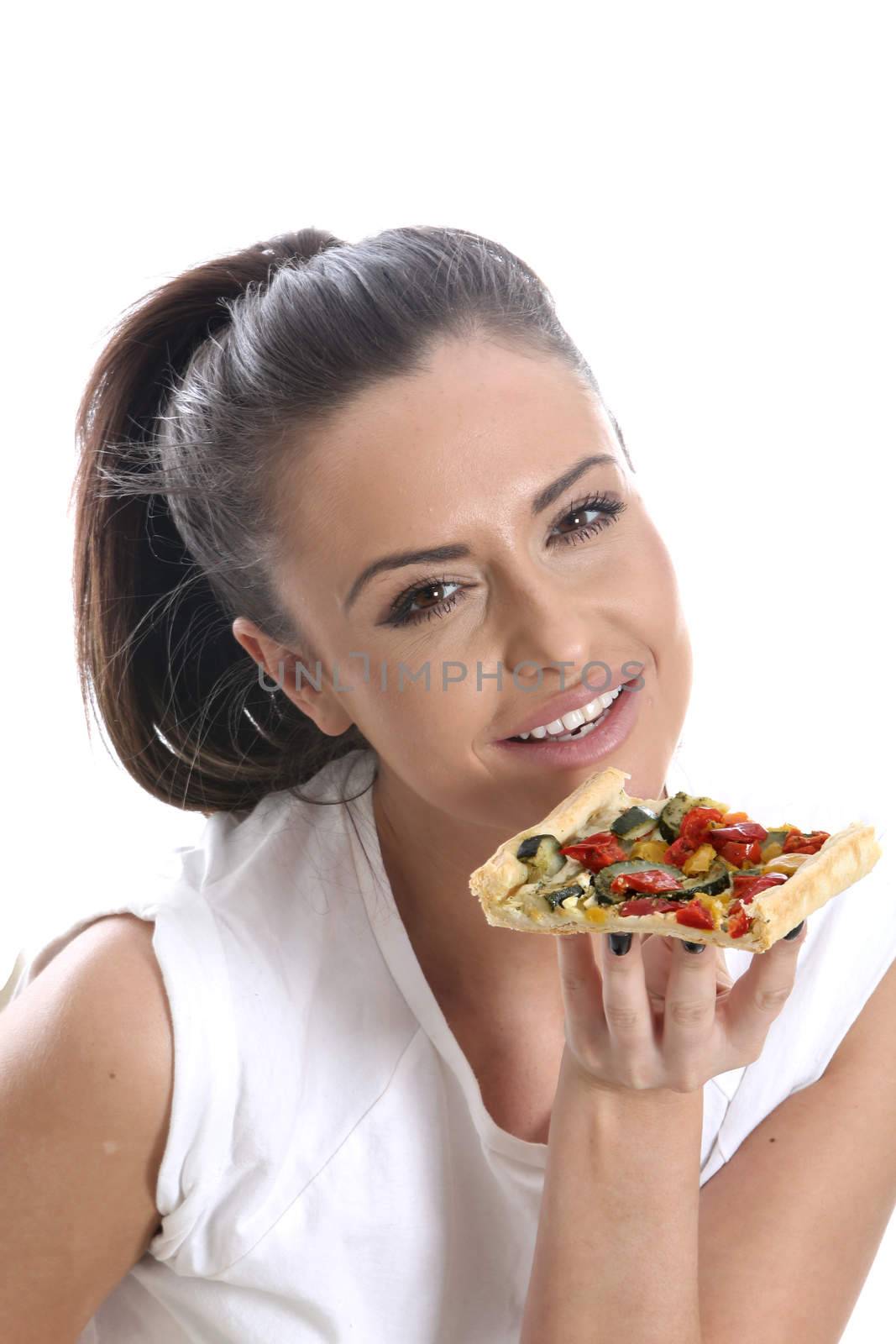 Model Released. Young Woman Eating Vegetable Pastry Tart