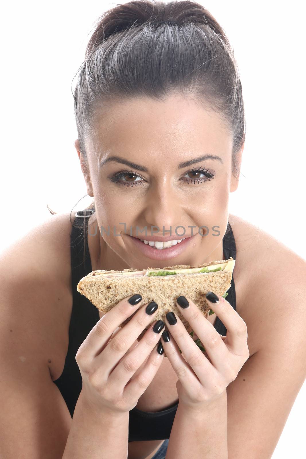 Model Released. Young Woman Eating Sandwich
