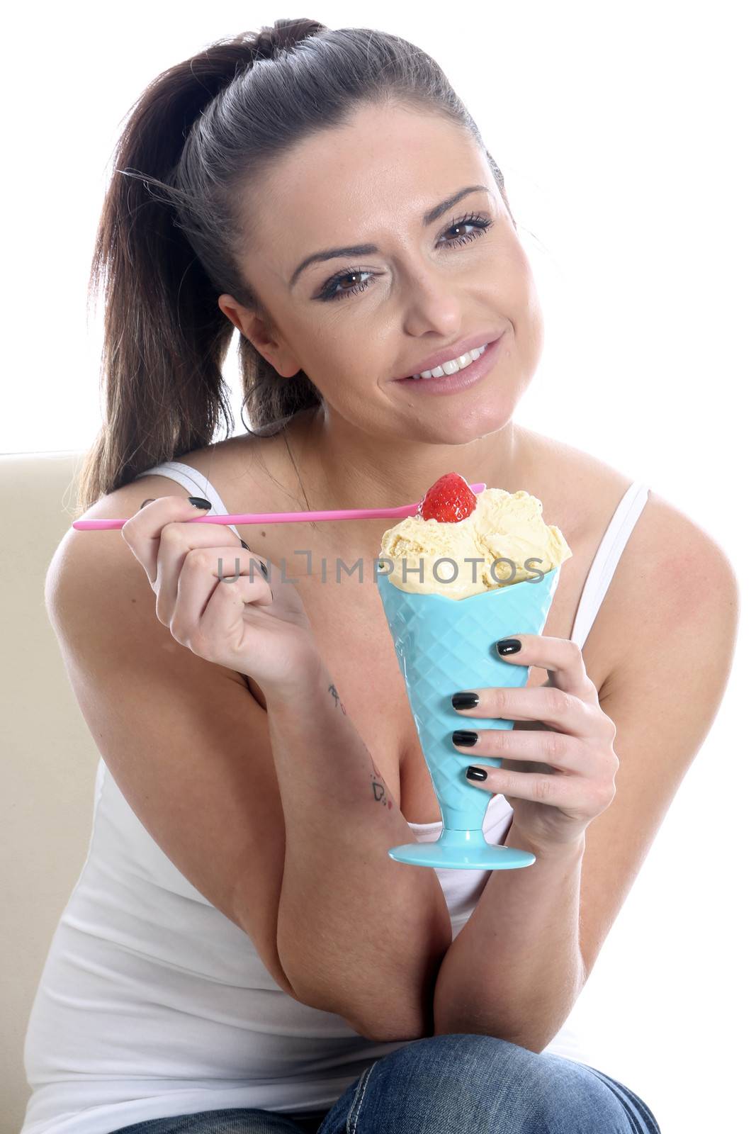 Model Released. Young Woman Eating Vanilla Ice Cream