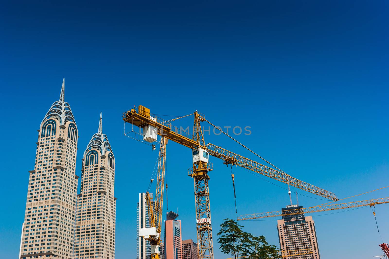 DUBAI, UAE - NOVEMBER 12: High rise buildings and streets nov 12. 2012 in Dubai, UAE. Copies of the U.S. towers. Dubai was the fastest developing city in the world between 2002 and 2008.