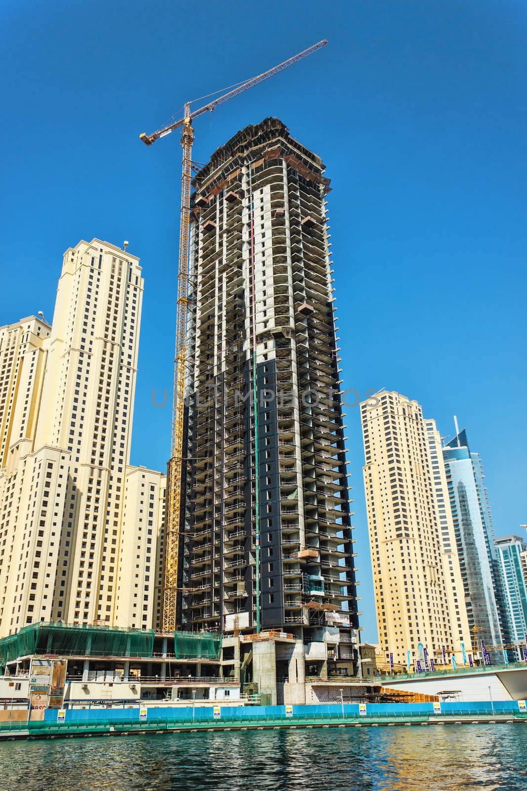 DUBAI, UAE - NOVEMBER 16:  Dubai Marina. Construction of skyscrapers in Dubai, UAE,  November 16, 2012. Skyscraper under construction in foreground. Dubai was the fastest developing city in the world between 2002 and 2008.