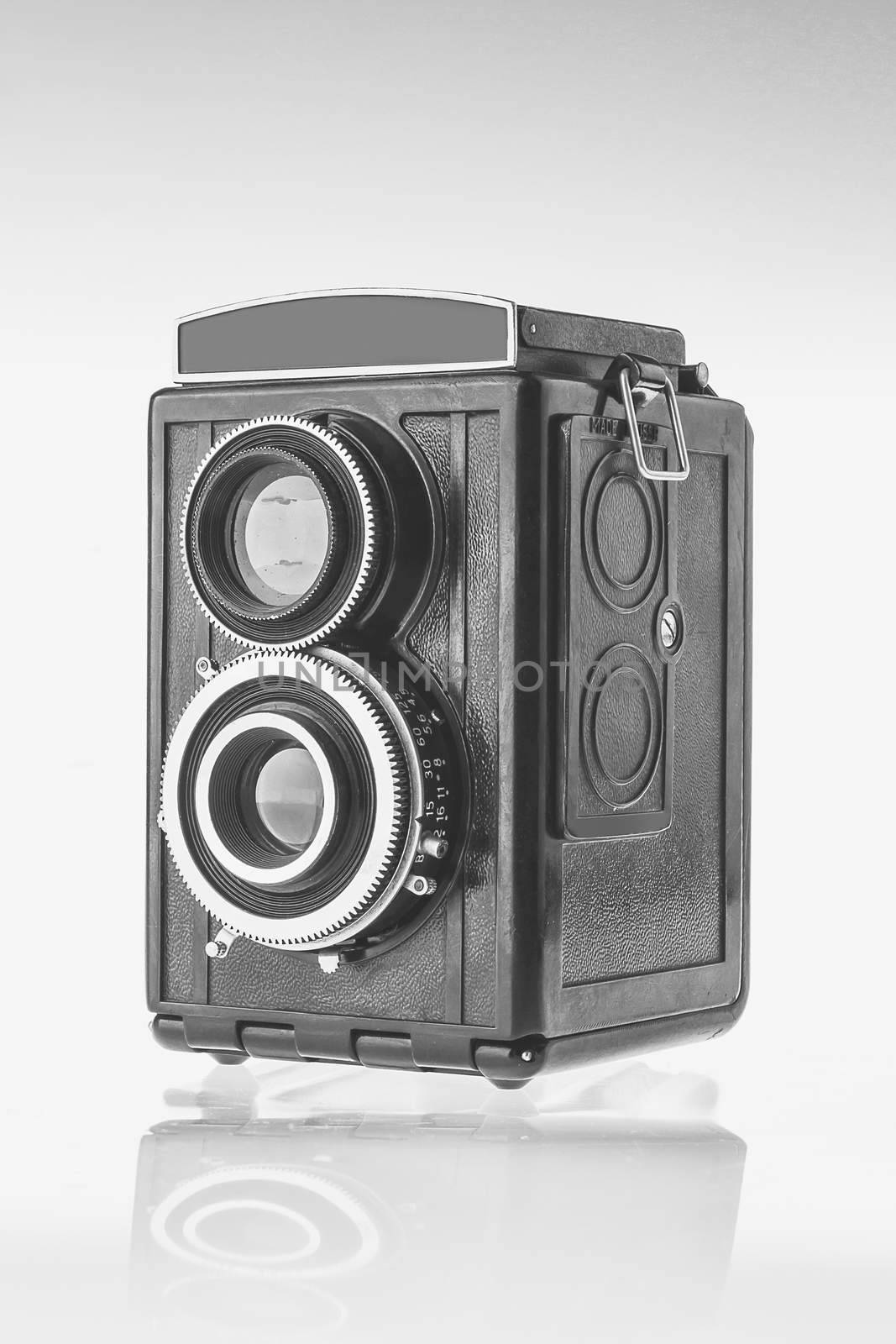 The black vintage reflex twin-lens camera for roll film