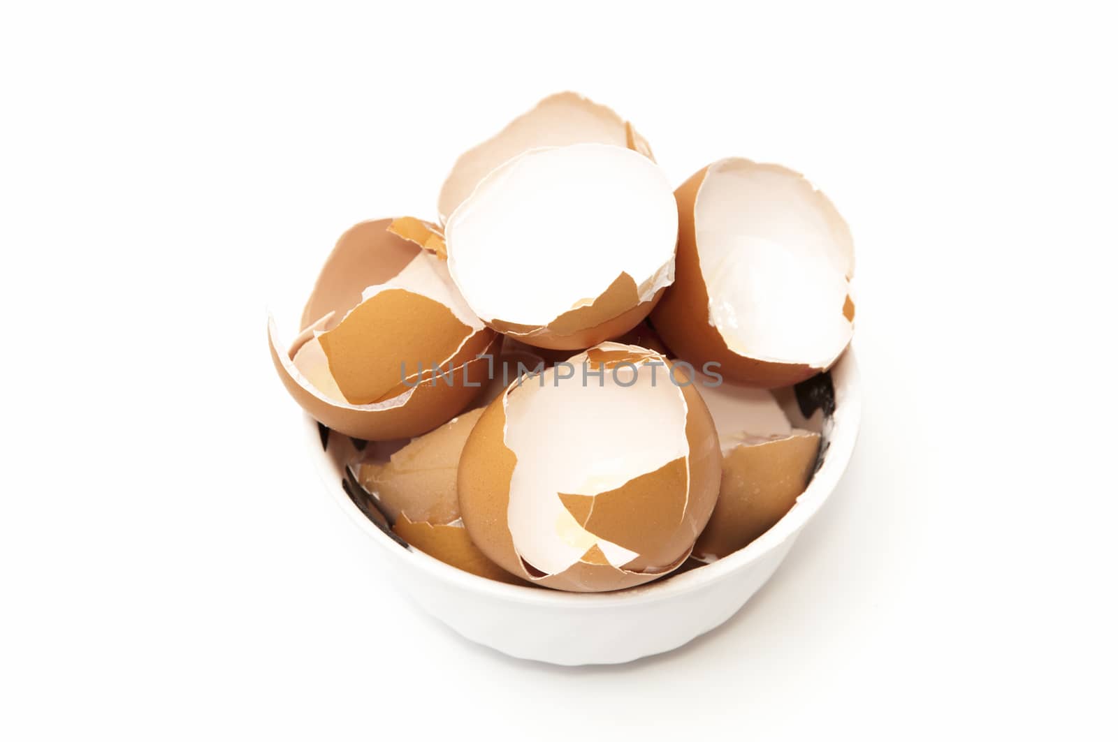bowl with broken egg on a white background
