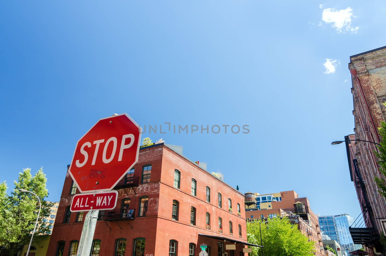 Brick building and stop sign on a street corner in Portland, Oregon