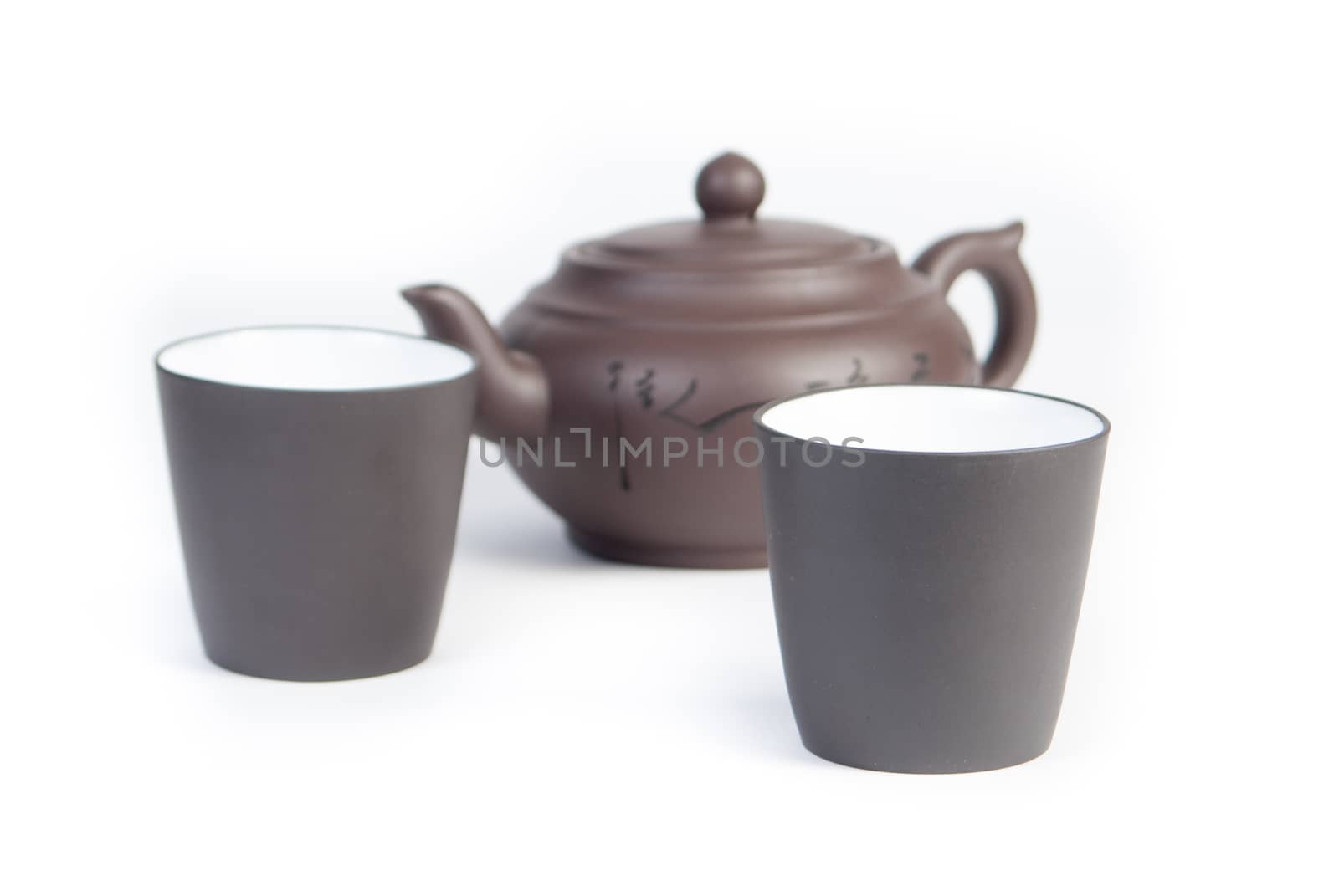 Chinese teapot with teacup on white background