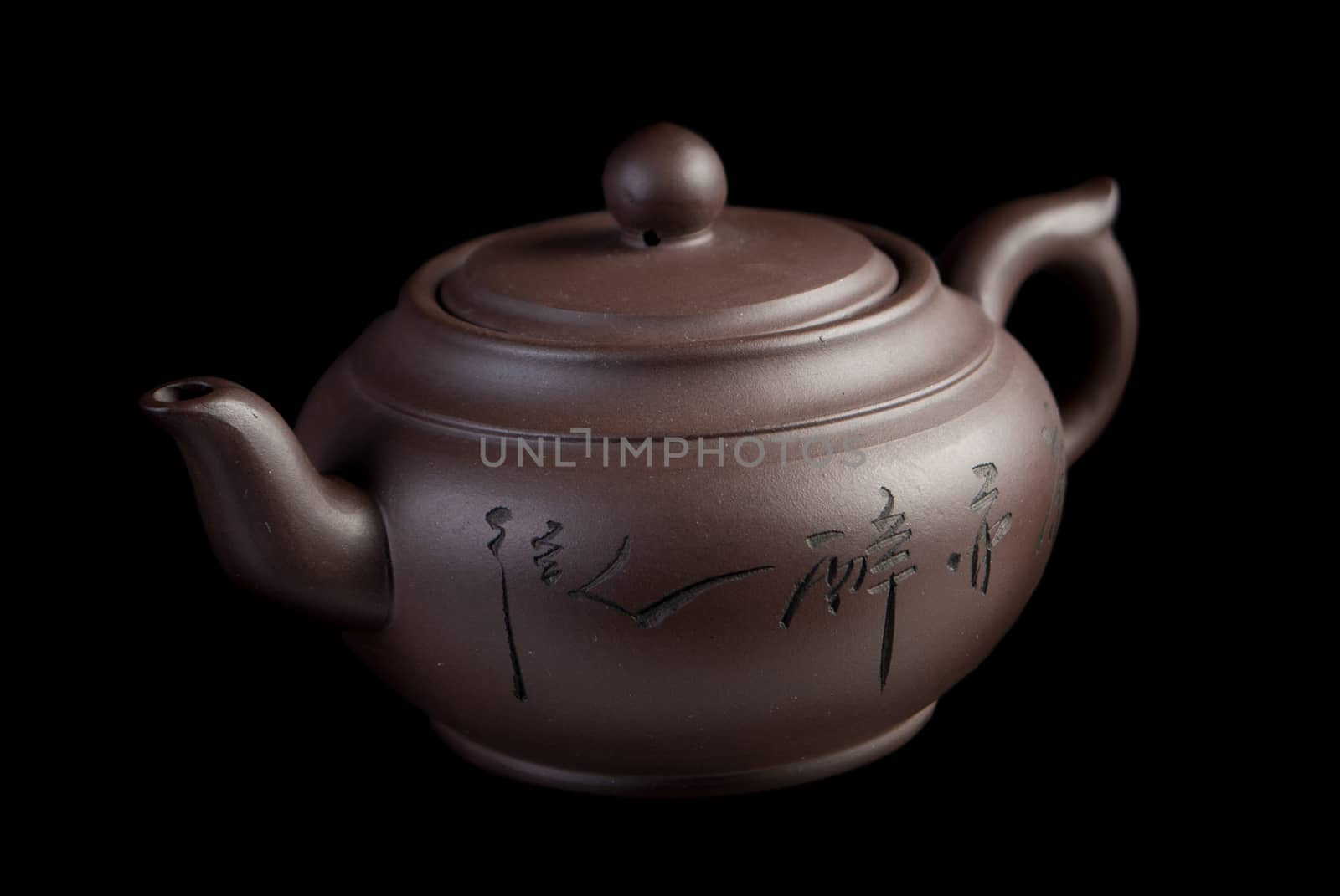 Chinese teapot on black background
