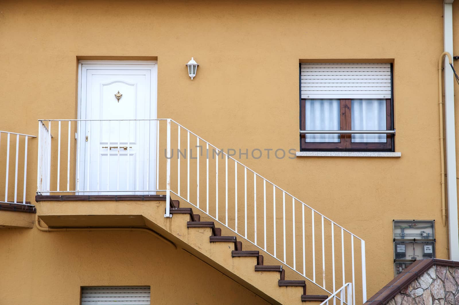home with stairs to reach the door