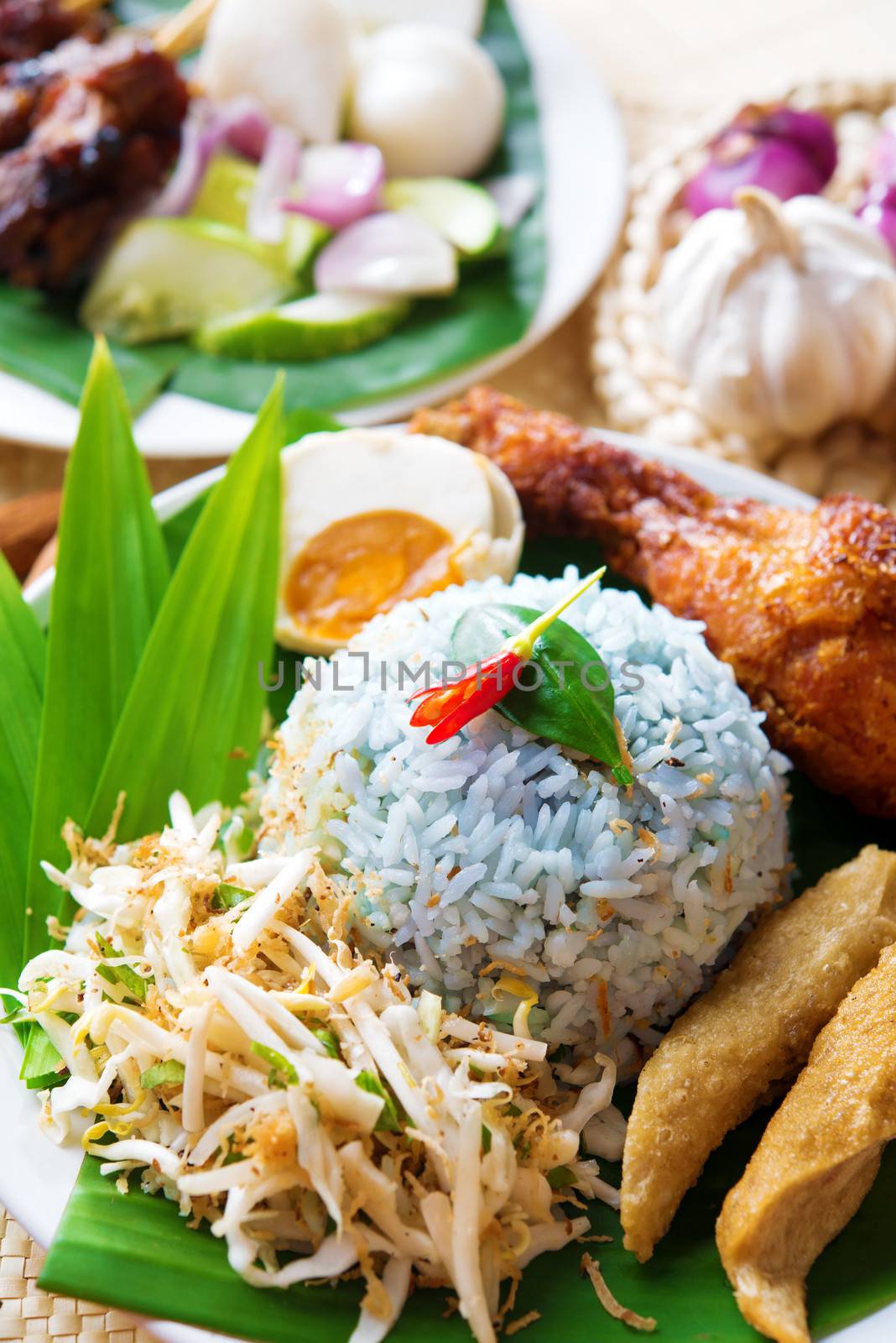 Nasi kerabu or nasi ulam, popular Malaysian Malay rice dish. Traditional east coast blue rice. Famous in states such as Terengganu or Kelantan . Malaysia food, Asian cuisine.