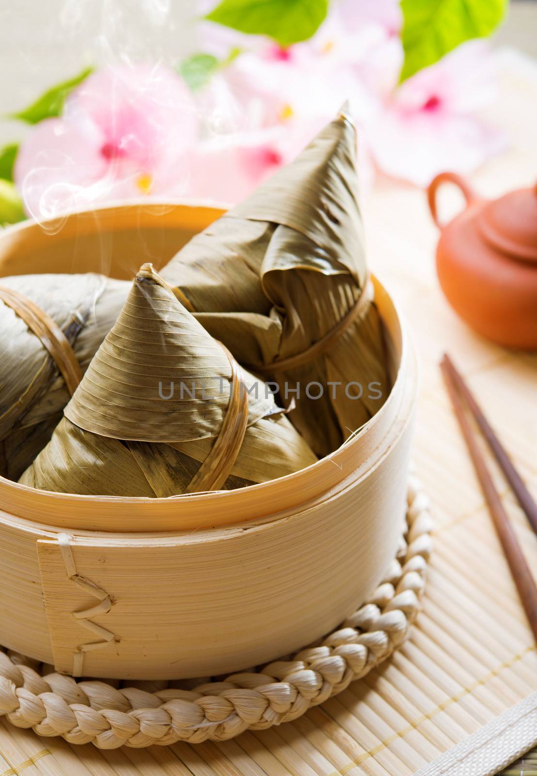 Hot rice dumpling or zongzi. Traditional steamed sticky  glutinous rice dumplings. Chinese food dim sum. Asian cuisine.