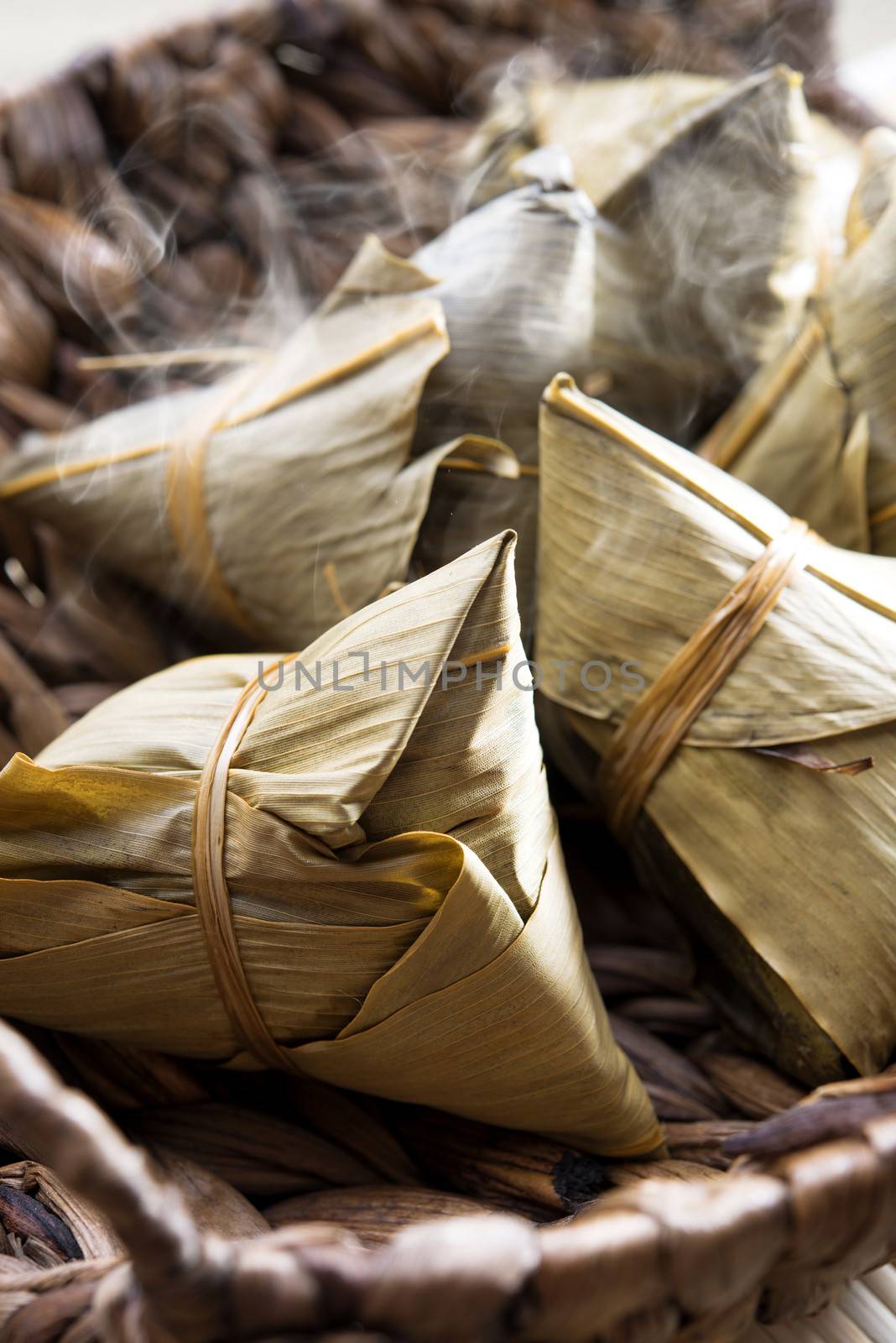 Fresh rice dumpling or zongzi. Traditional steamed sticky  glutinous rice dumplings. Chinese food dim sum. Asian cuisine.