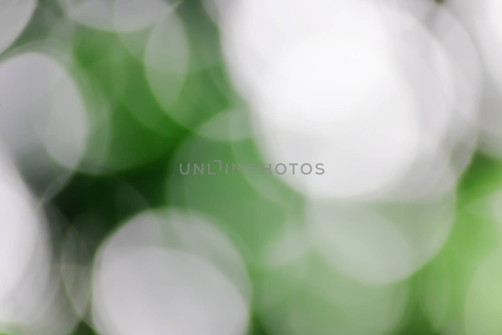 Blurred lights green bokeh abstract light background