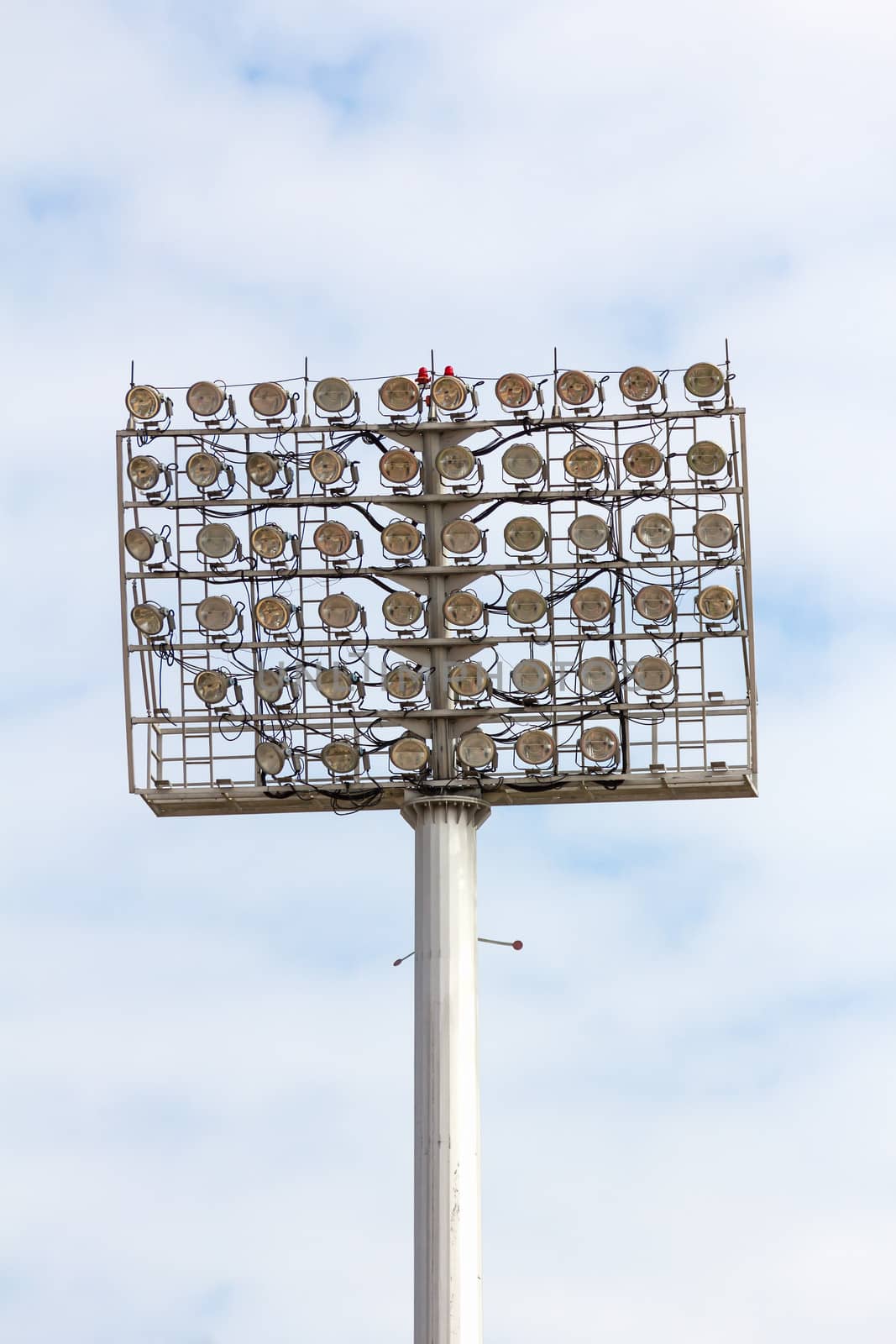 The Stadium Spot-light tower over Blue Sky