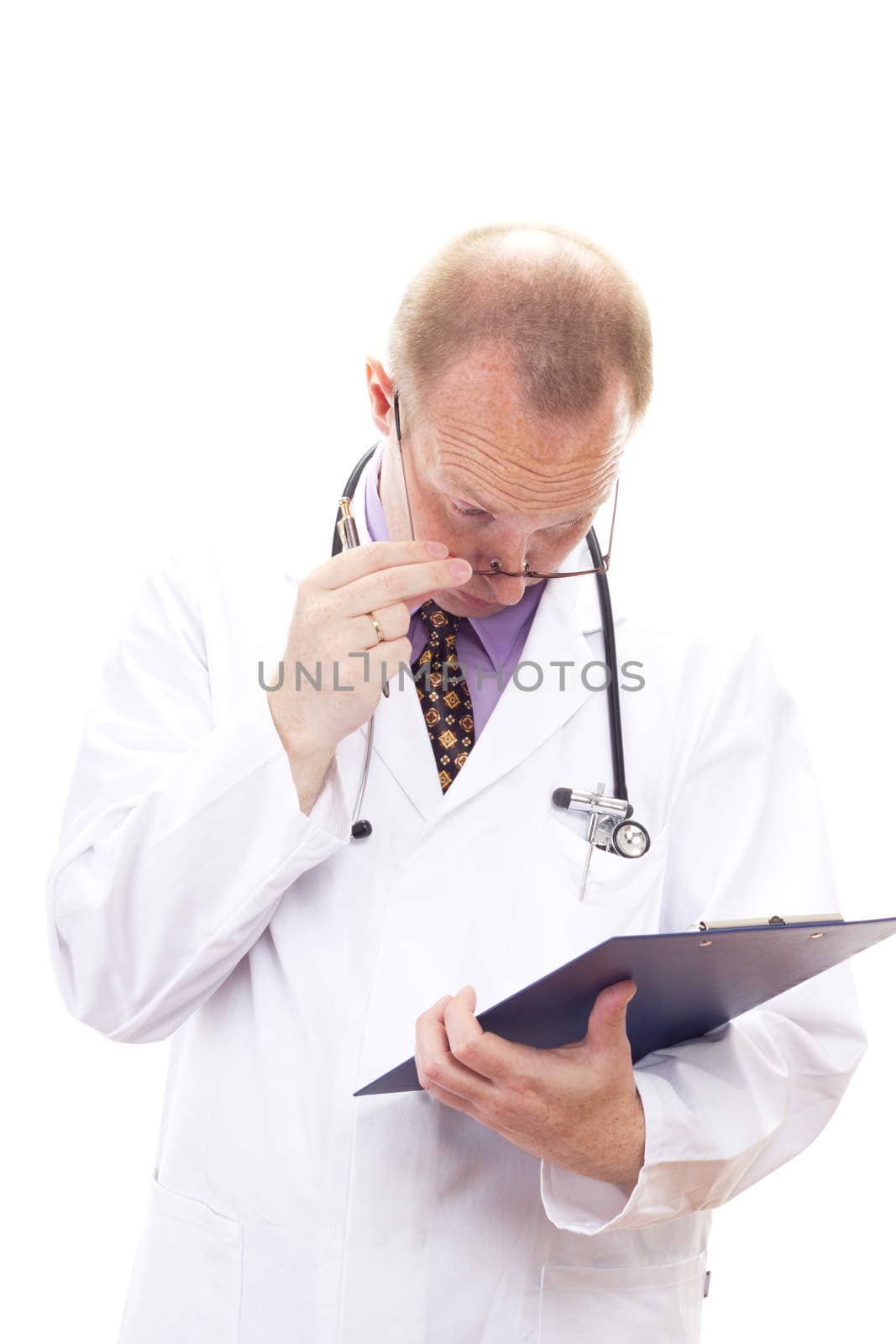 Stunned medical doctor reading patients file