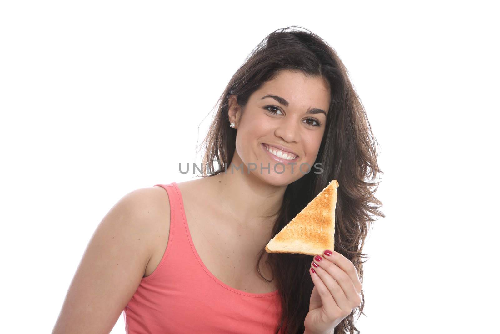 Model Released. Young Woman Eating a Slice of Toast