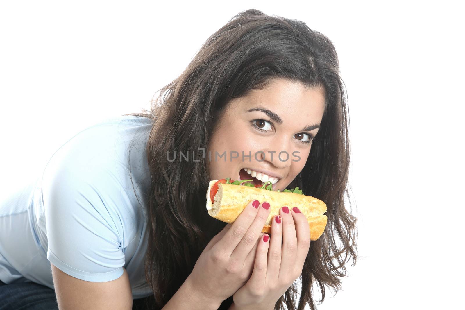 Model Released. Young Woman Eating Cheese and Tomato Roll