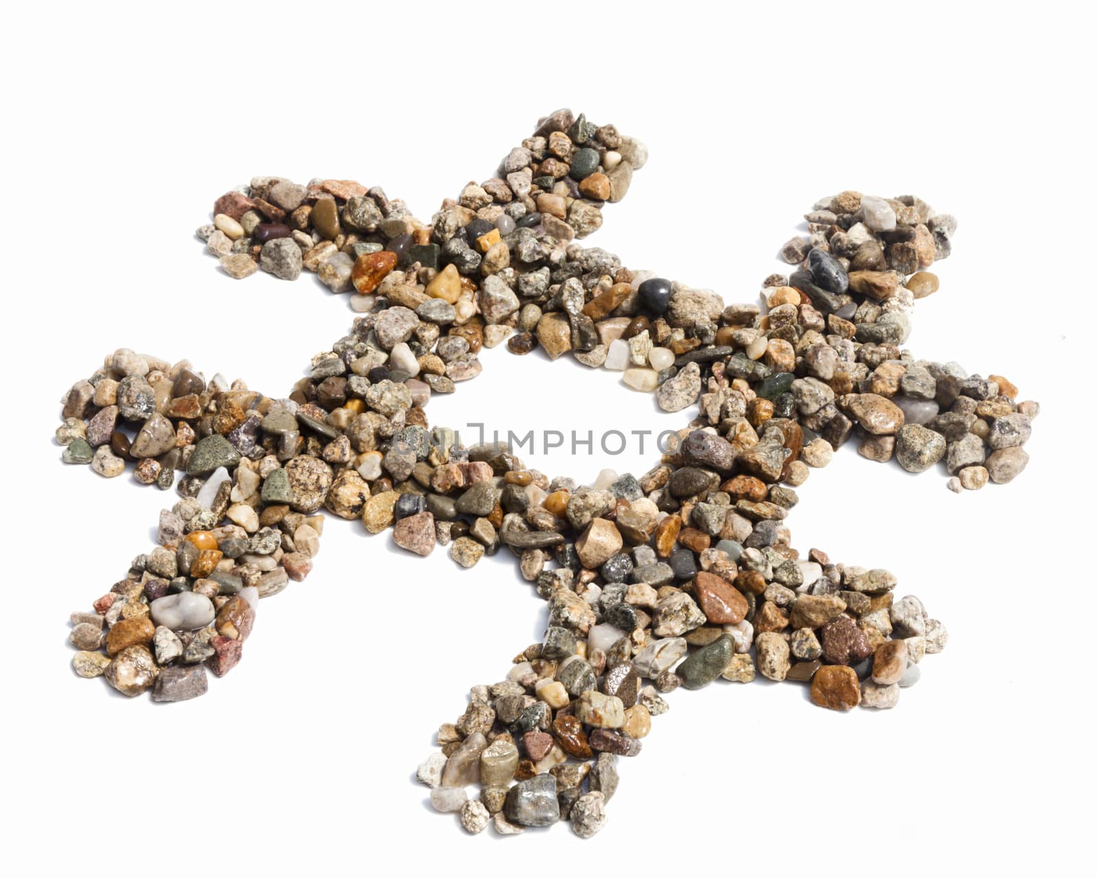 A hashtag symbol made pebbles against a white background.