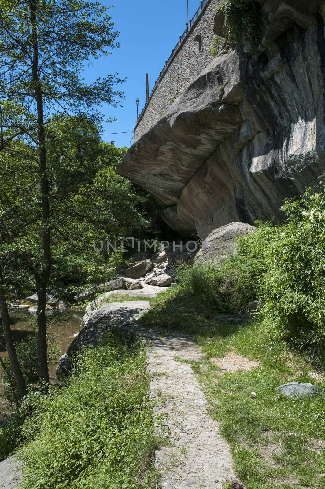 huge stone mountain surrounded by vegetation