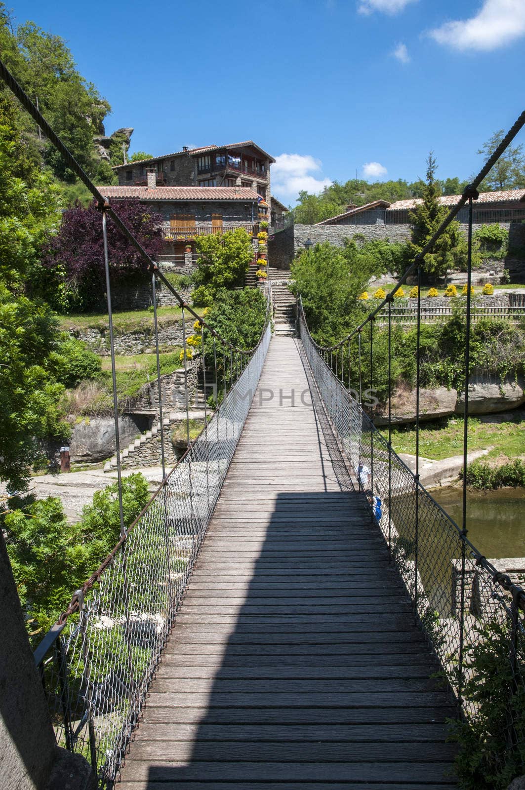 Rupit suspension bridge through which the river