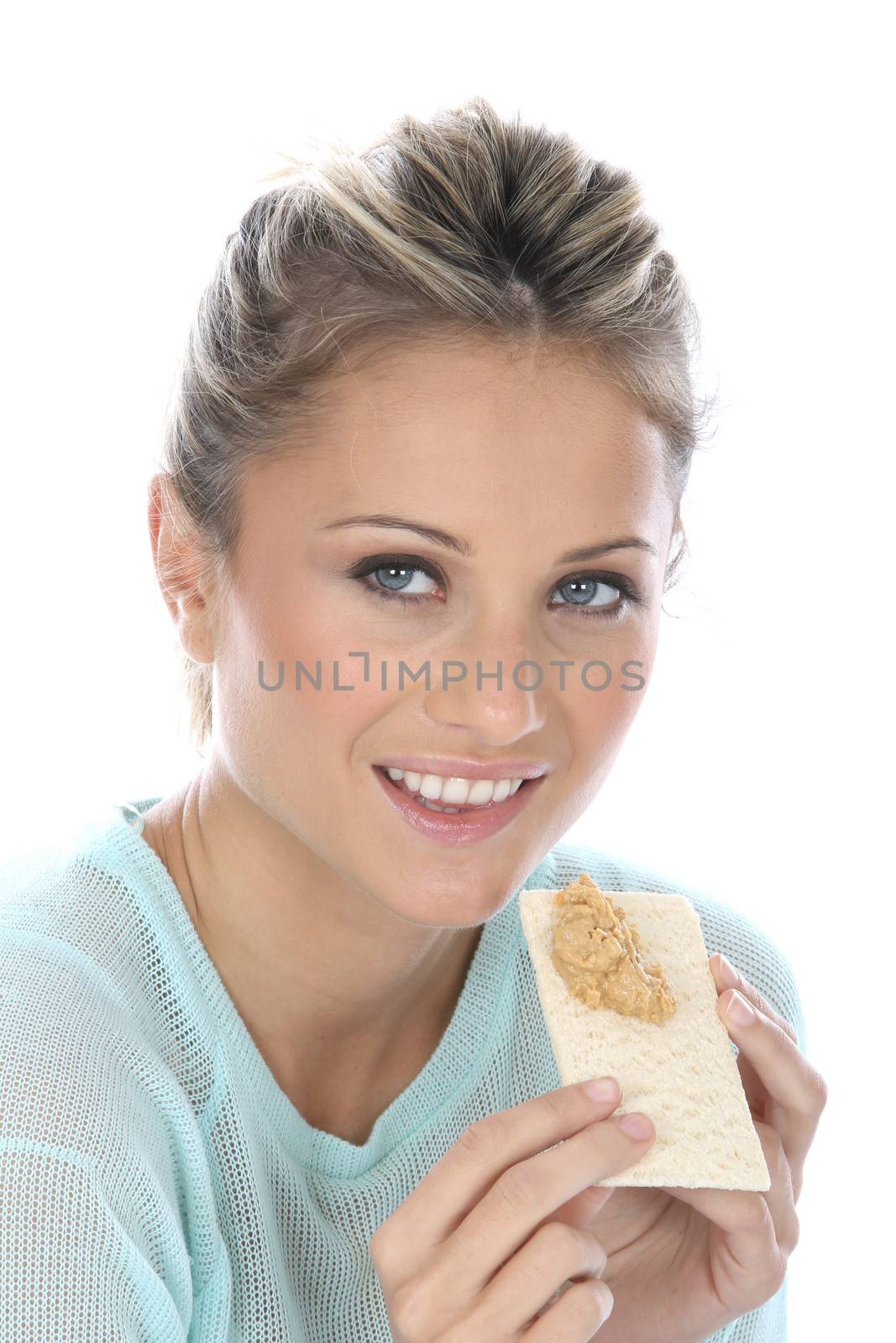 Woman Eating Crispbread with Peanut Butter