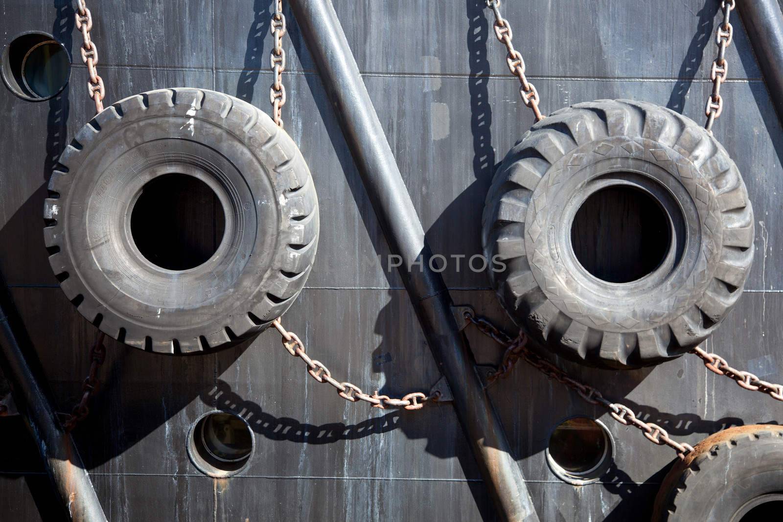 old tires used for protection of ship by ahavelaar