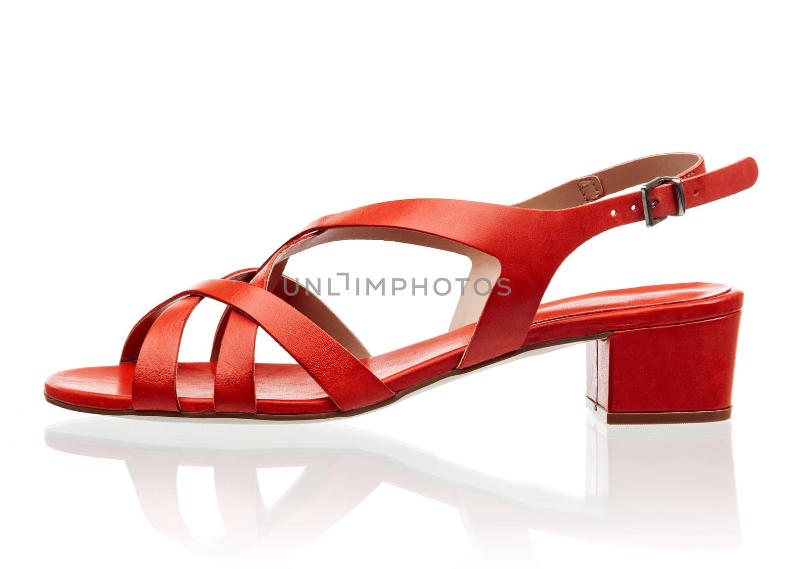 Red female sandal isolated over white background by photobac