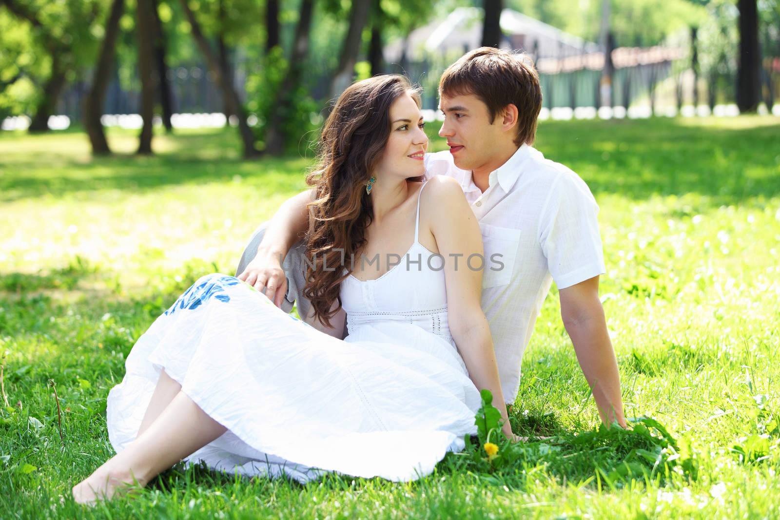 Young love Couple smiling under blue sky by sergey_nivens