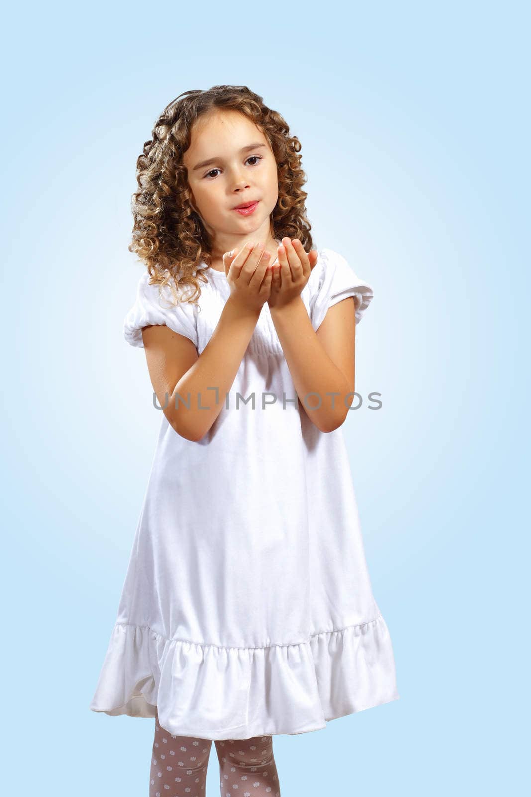 Portrait of an adorable preschool age girl wearing a Christmas holiday outfit