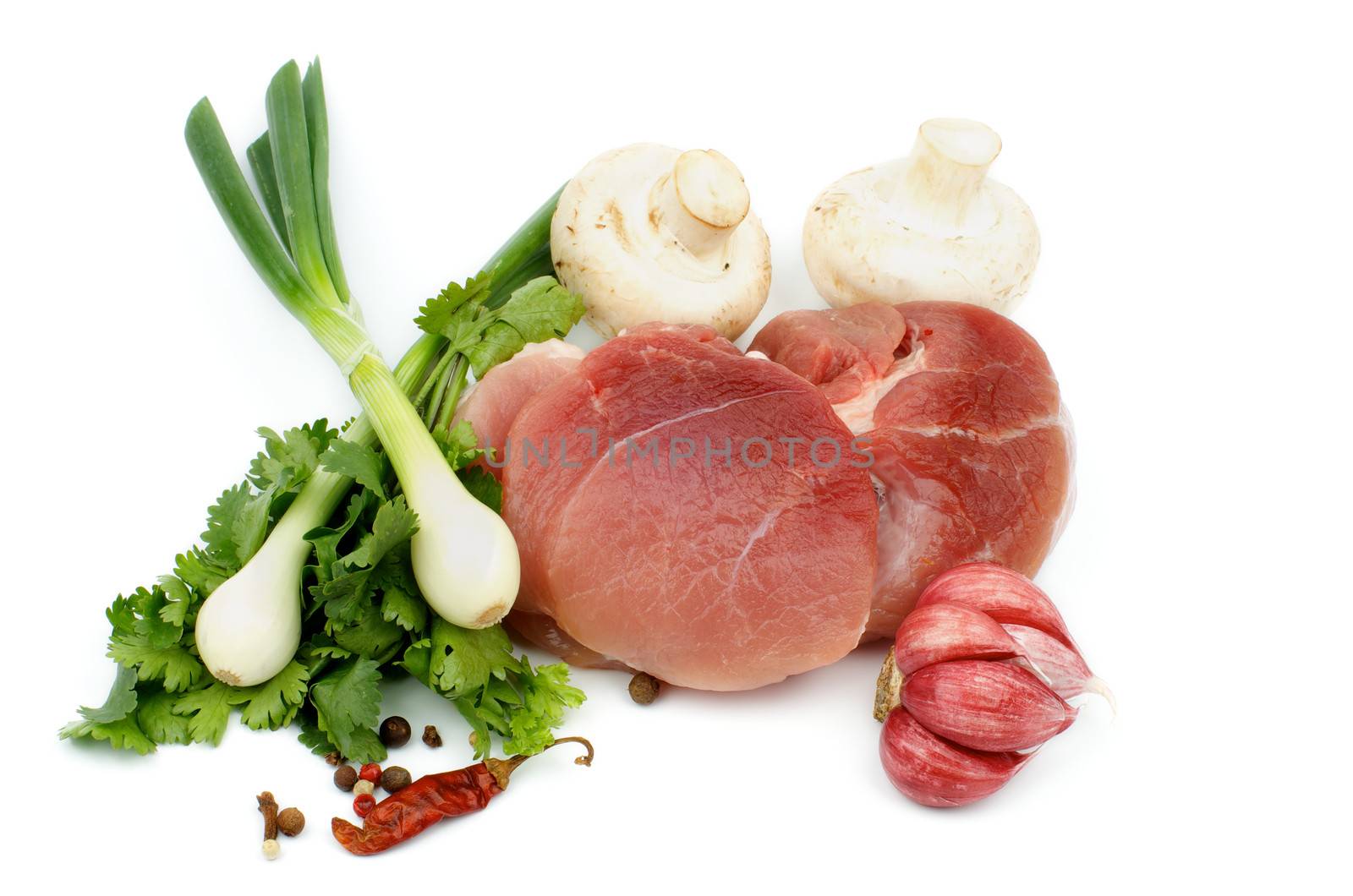 Perfect Piece of Boneless Raw Pork with Greens, Spring Onion, Spices and Edible Mushrooms isolated on white background