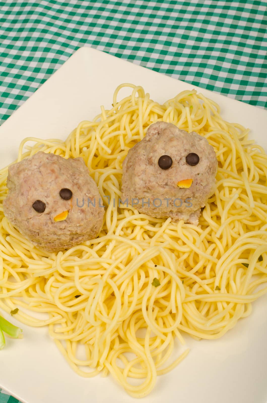 Portion of spaghetti with a funny decoration for kids
