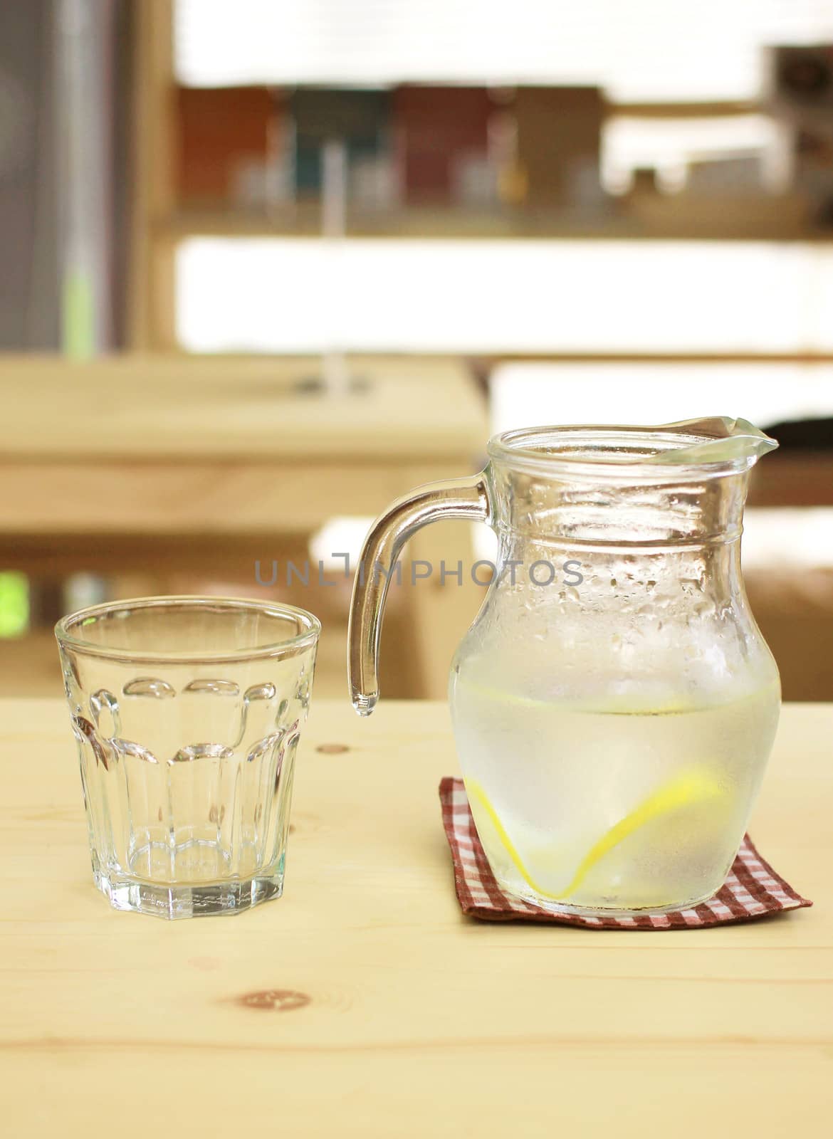 Jar of lemonade with empty glass for summer by nuchylee