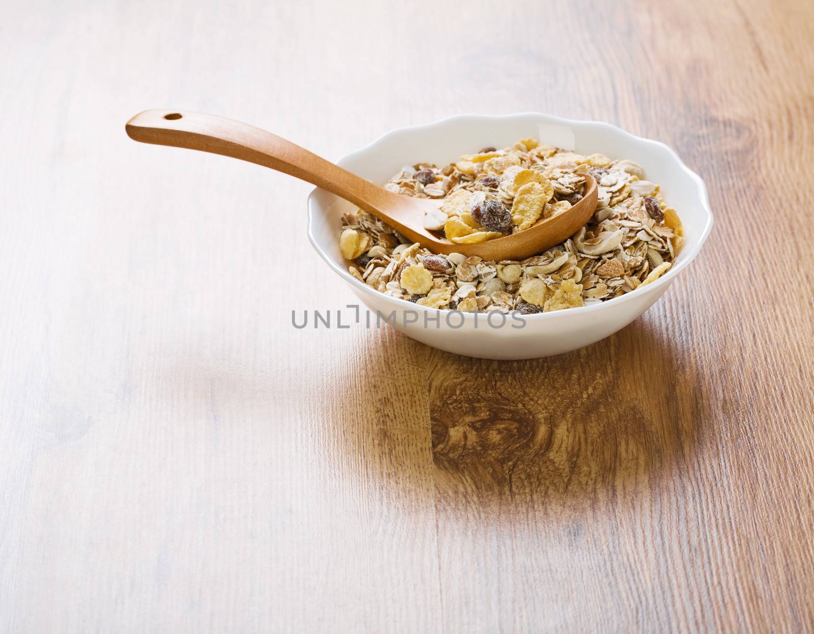 bowl with muesli an spoon by mihalec