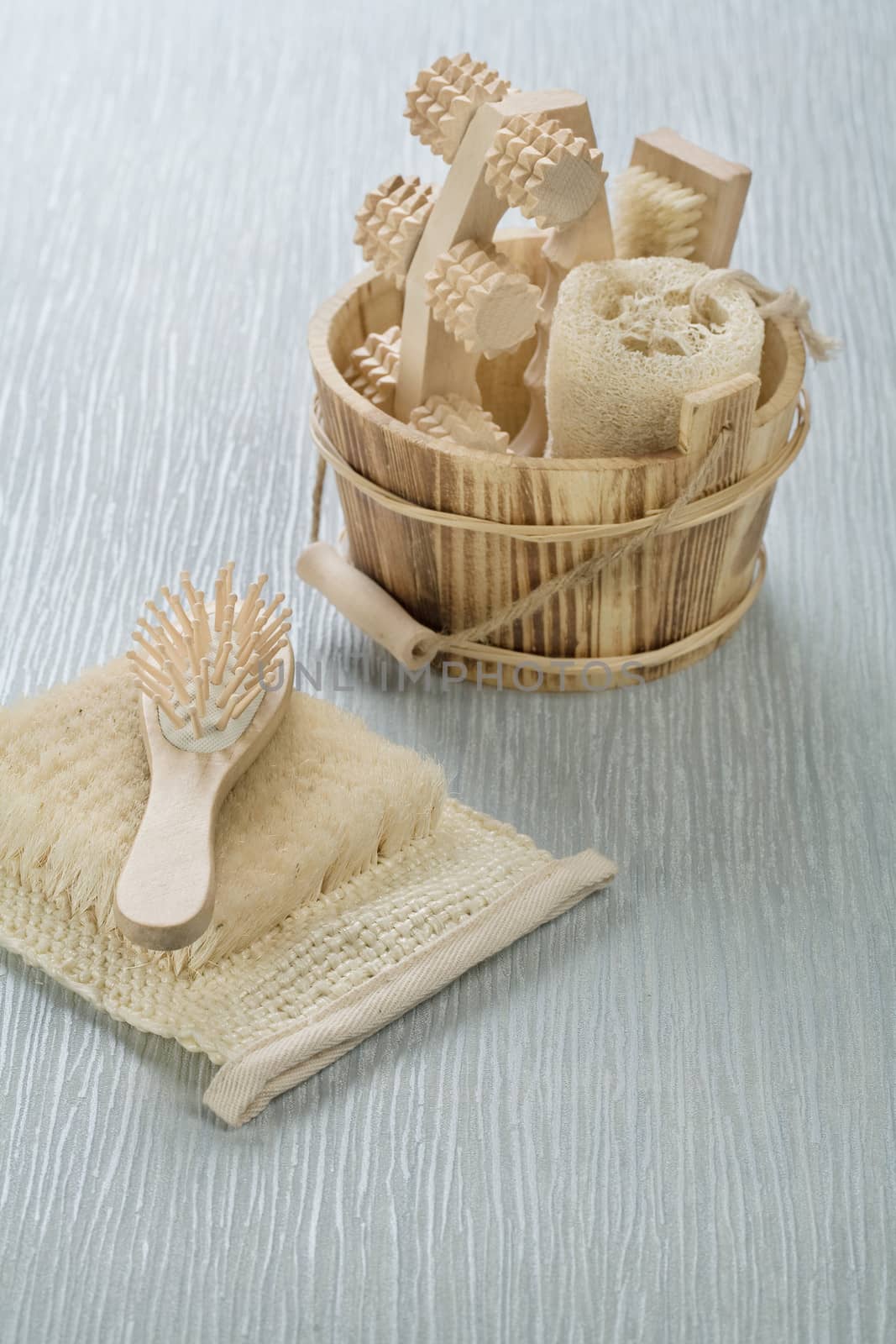 hairbrush on bast with wooden bucket by mihalec
