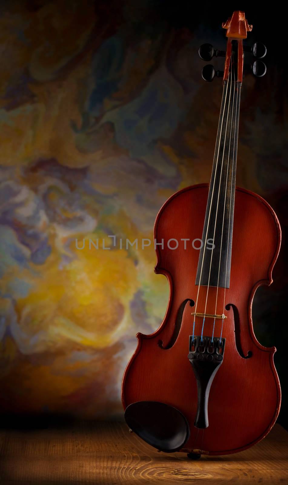 old violin on wooden board
