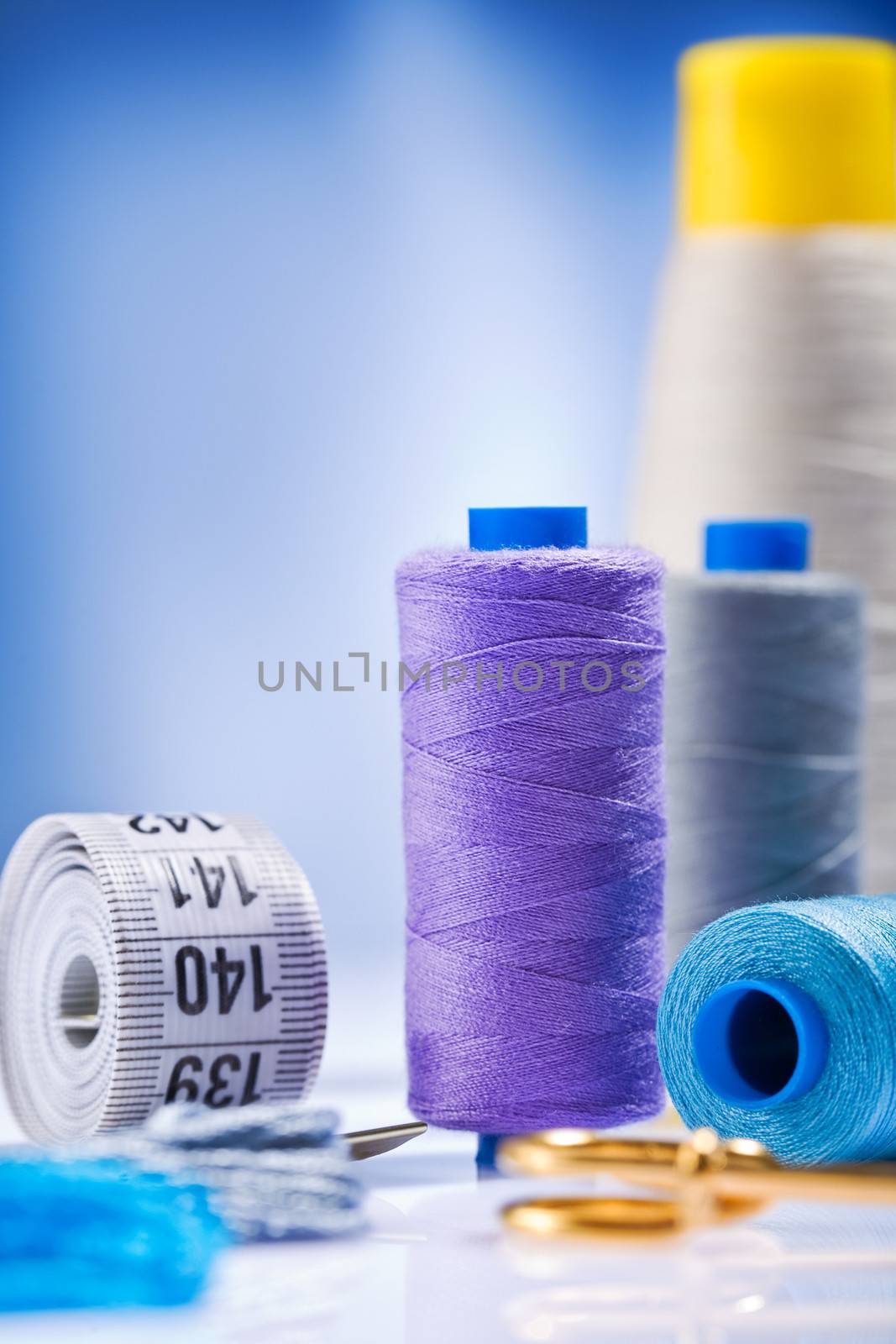 sewing spools with threads and other items