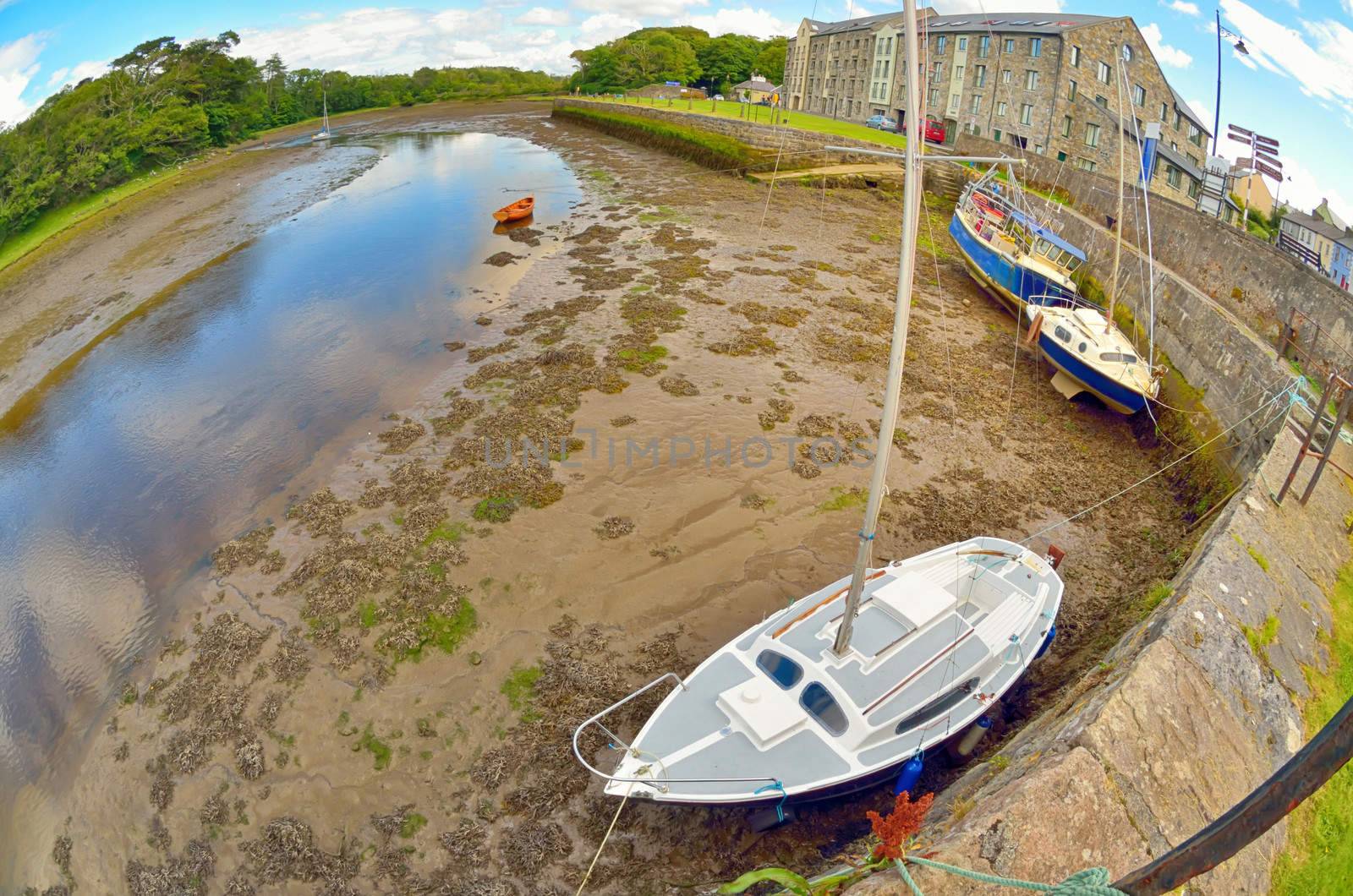 boats on the river shore in ireland