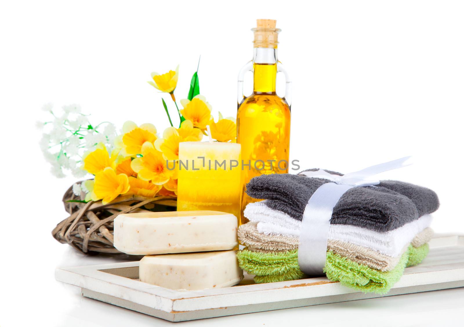 two bars of soap and toiletries for relaxation, isolated on white background