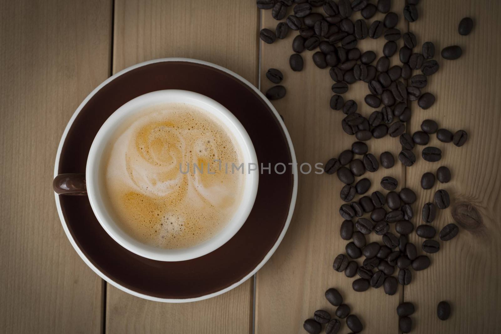 cup of coffee on wooden background