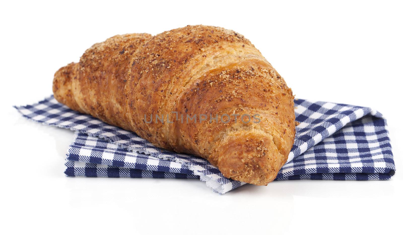 Fresh and tasty croissant over white background