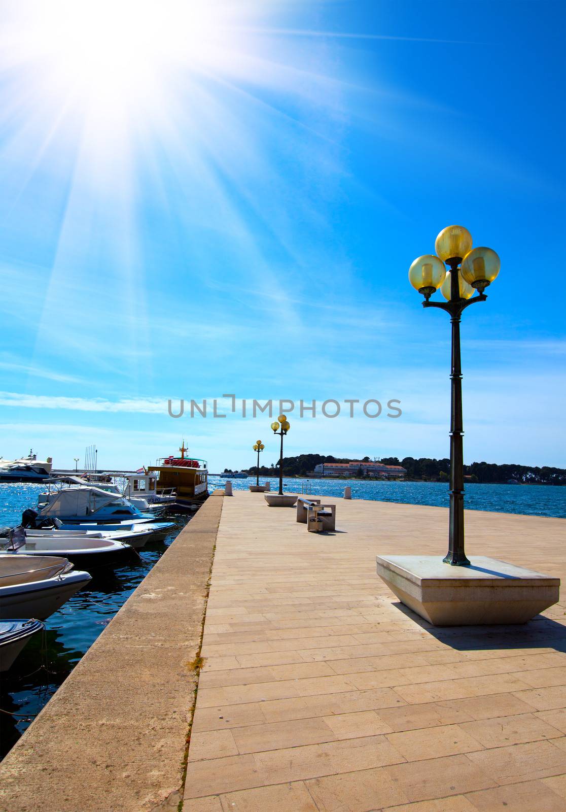 berth with street-lamp on sea background. Pula Croatia by motorolka