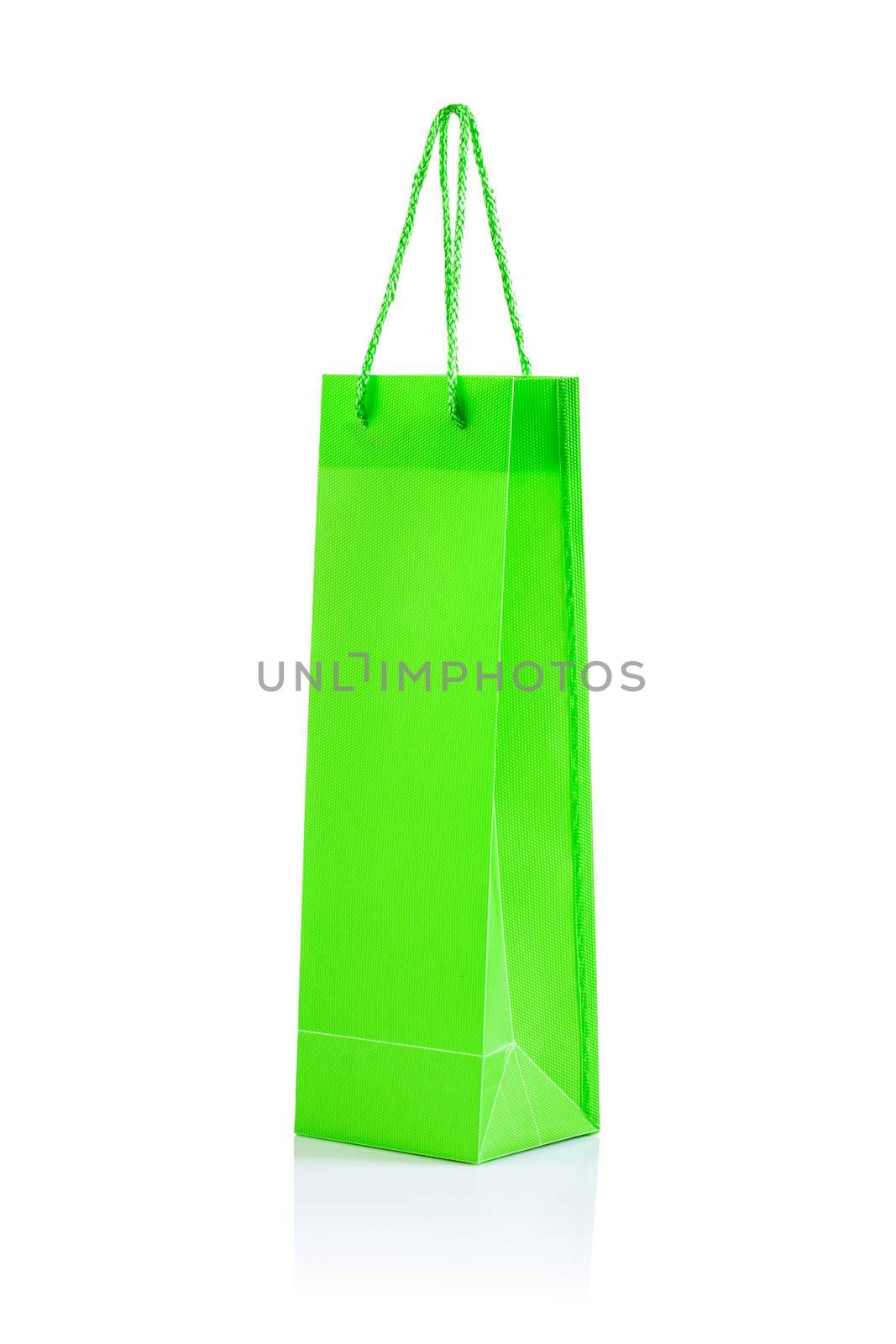 a green paper bag isolated on white